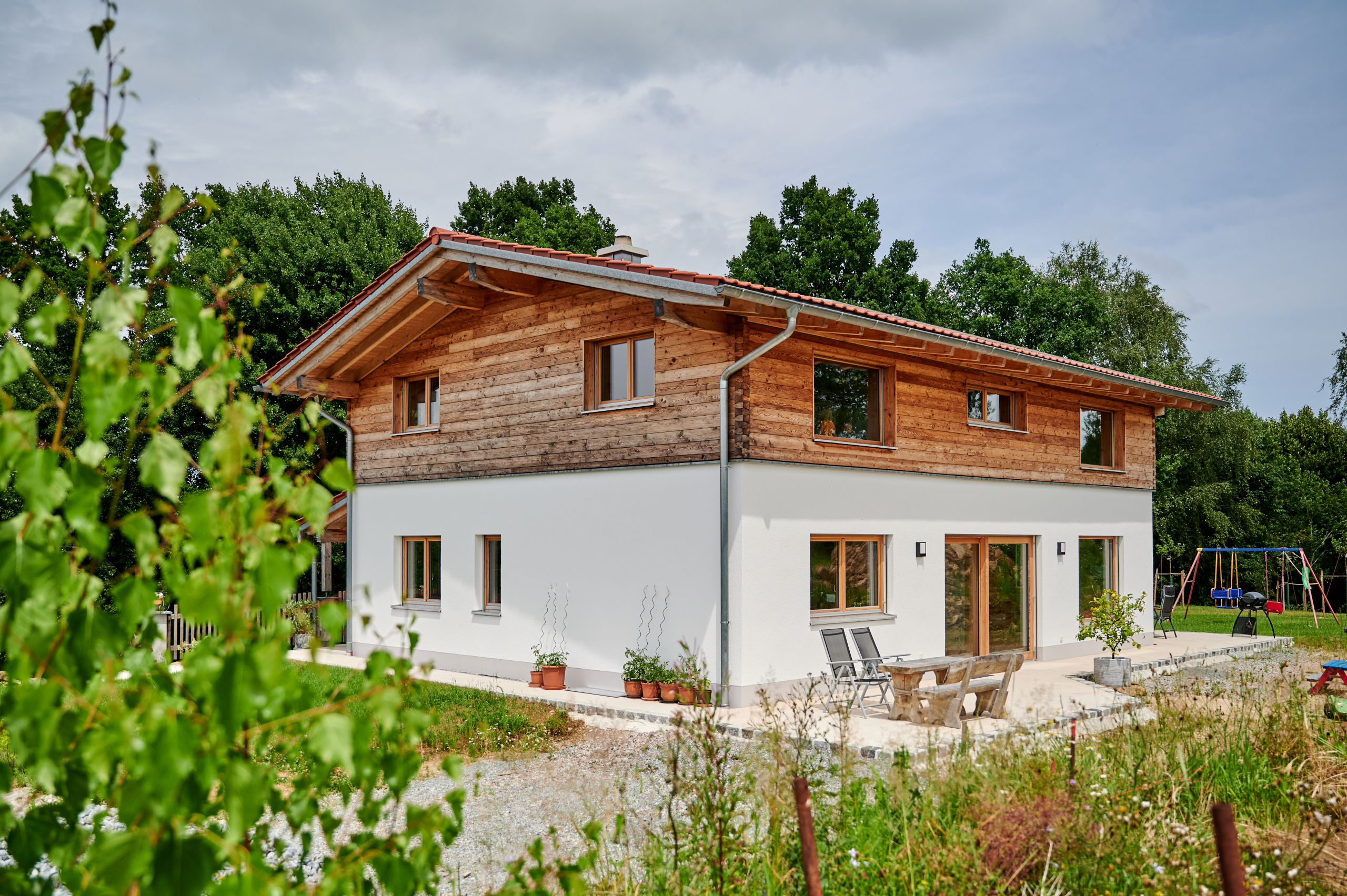 Massivholzhaus Sche_W mit Blockfassade